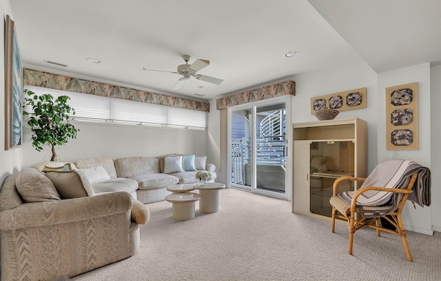 living room with recessed lighting, visible vents, carpet floors, and a ceiling fan