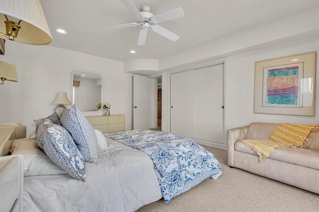 carpeted bedroom featuring recessed lighting, a closet, and a ceiling fan