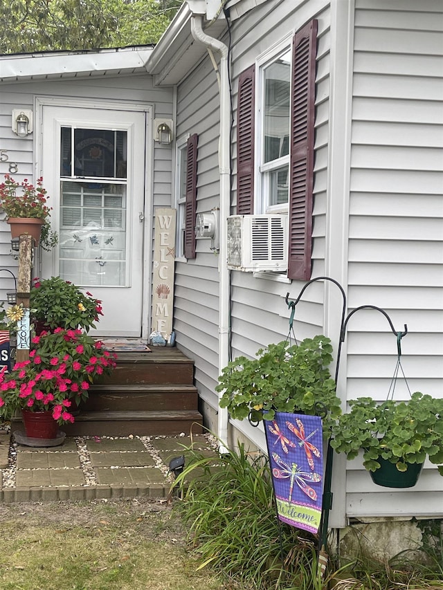 property entrance featuring cooling unit