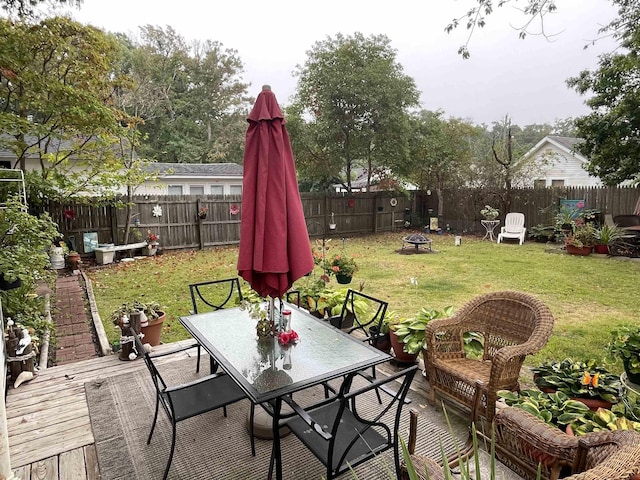 view of patio with a fire pit