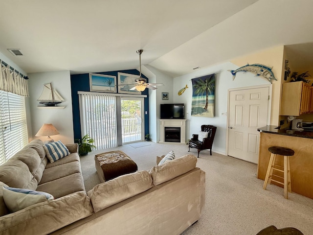 407 W Andrews Ave Unit 200, Wildwood, NJ 08260 - living area featuring light colored carpet, a ceiling fan, vaulted ceiling, and a fireplace