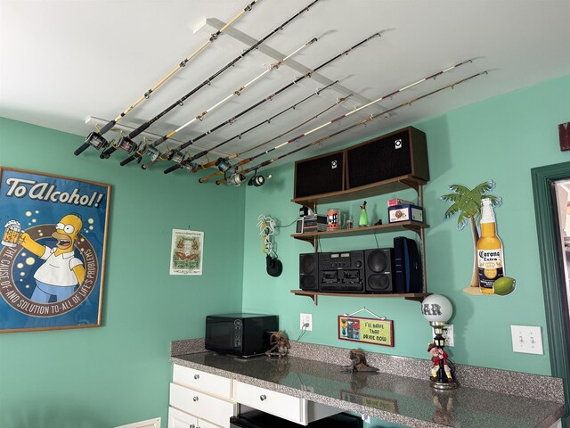 407 W Andrews Ave Unit 200, Wildwood, NJ 08260 - kitchen featuring black microwave, dark countertops, and open shelves