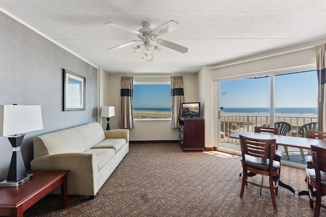 living room with dark colored carpet and ceiling fan