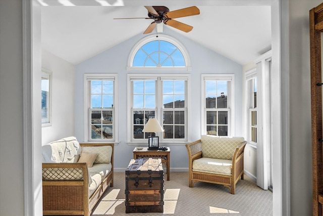 sunroom / solarium featuring lofted ceiling and ceiling fan