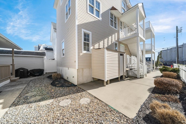 view of side of property with fence