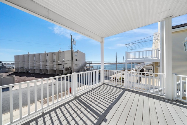 deck featuring a water view