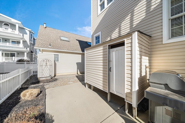 view of patio featuring fence and area for grilling