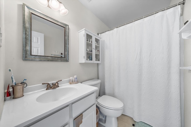 full bath featuring vanity, toilet, and tile patterned floors