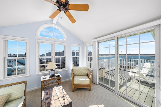 sunroom featuring vaulted ceiling and ceiling fan