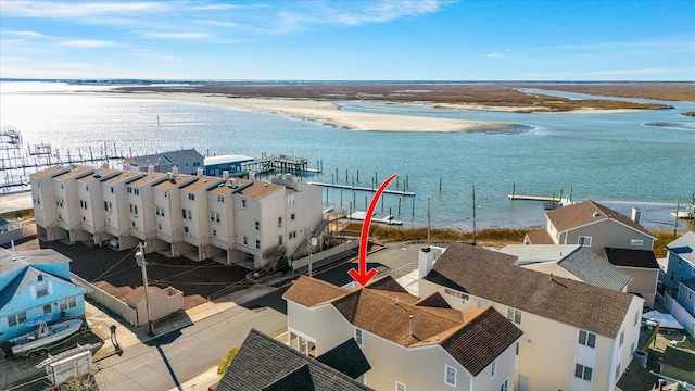 aerial view with a residential view and a water view