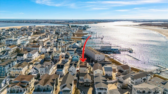 bird's eye view featuring a residential view and a water view