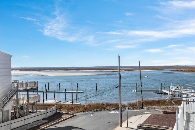 exterior space featuring a water view and a boat dock