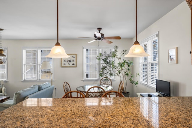 kitchen with ceiling fan and decorative light fixtures