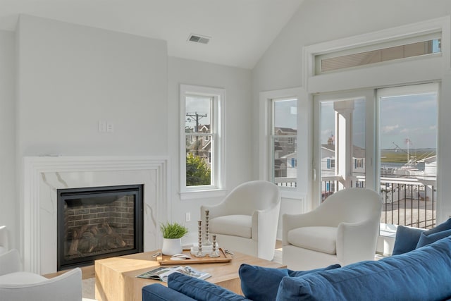 520 21st St, Avalon, NJ 08202 - living area featuring lofted ceiling, wood finished floors, and a fireplace