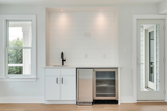 520 21st St, Avalon, NJ 08202 - indoor wet bar with wine cooler, light wood-style flooring, and built in refrigerator