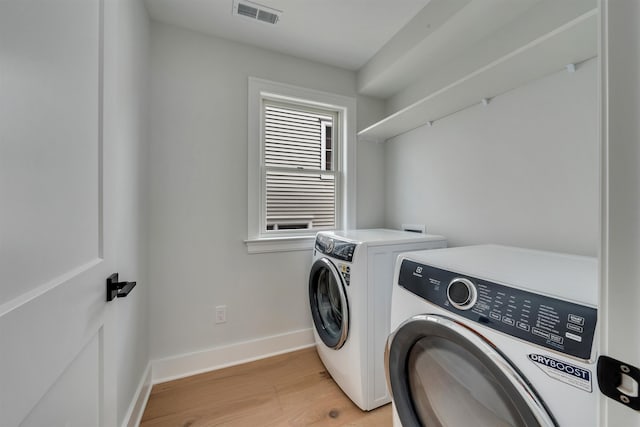 520 21st St, Avalon, NJ 08202 - laundry area with washer and dryer and light wood-style flooring