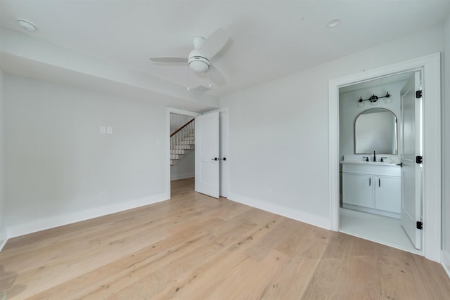 520 21st St, Avalon, NJ 08202 - unfurnished bedroom with light wood-style flooring, connected bathroom, and ceiling fan