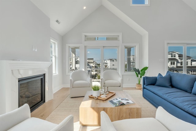 520 21st St, Avalon, NJ 08202 - living area with high vaulted ceiling, light wood finished floors, and a high end fireplace
