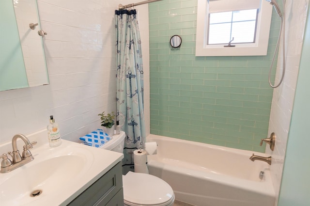 full bathroom featuring shower / tub combo, vanity, and toilet