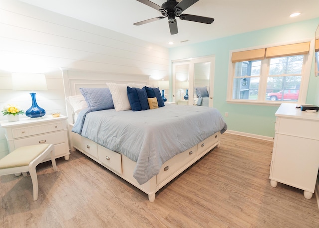 bedroom with a ceiling fan, light wood-type flooring, baseboards, and recessed lighting