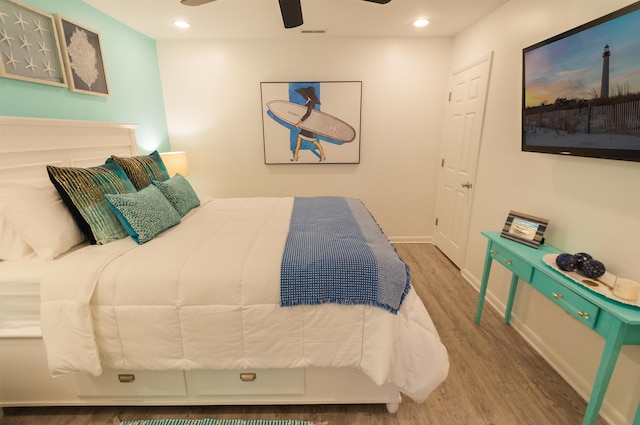 bedroom featuring ceiling fan, visible vents, wood finished floors, and recessed lighting