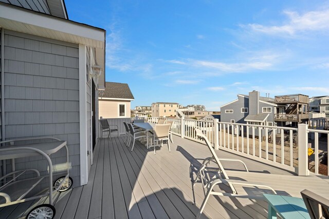367 21st St, Avalon, NJ 08202 - wooden deck with outdoor dining area and a residential view
