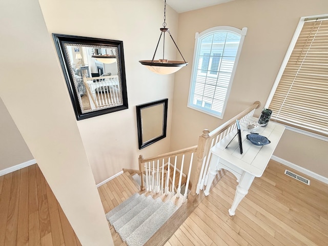 367 21st St, Avalon, NJ 08202 - staircase featuring wood finished floors and baseboards