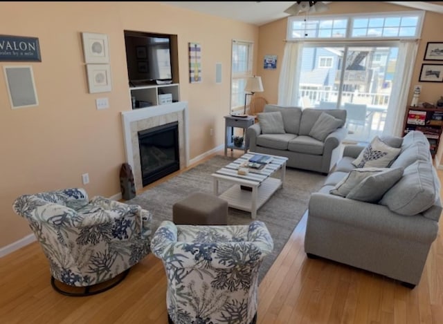 367 21st St, Avalon, NJ 08202 - living area with vaulted ceiling, wood finished floors, a fireplace, and baseboards