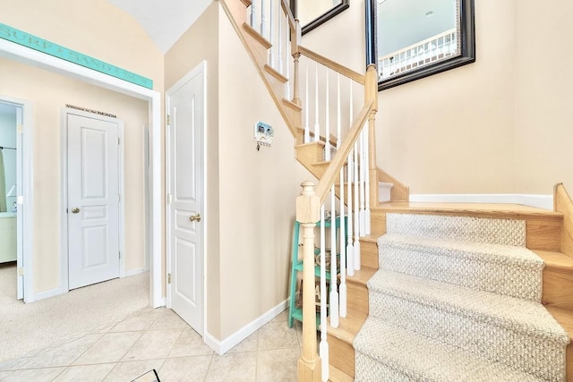 367 21st St, Avalon, NJ 08202 - staircase featuring baseboards and tile patterned flooring