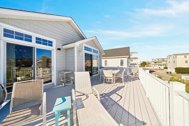 367 21st St, Avalon, NJ 08202 - wooden terrace featuring outdoor dining area and a residential view