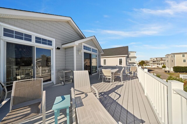 367 21st St, Avalon, NJ 08202 - wooden deck with outdoor dining space and a residential view