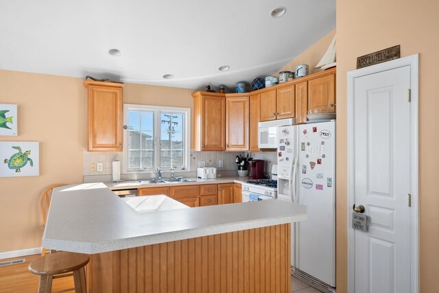 367 21st St, Avalon, NJ 08202 - kitchen featuring white appliances, a sink, decorative backsplash, light countertops, and recessed lighting