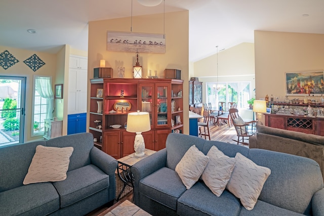 41 Summer Cir, North Cape May, NJ 08204 - living area featuring a chandelier and high vaulted ceiling