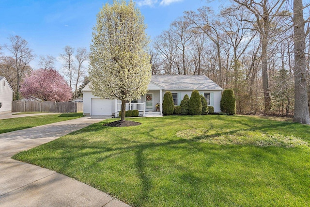 ranch-style home featuring a porch, a front yard, a garage, fence, and concrete driveway