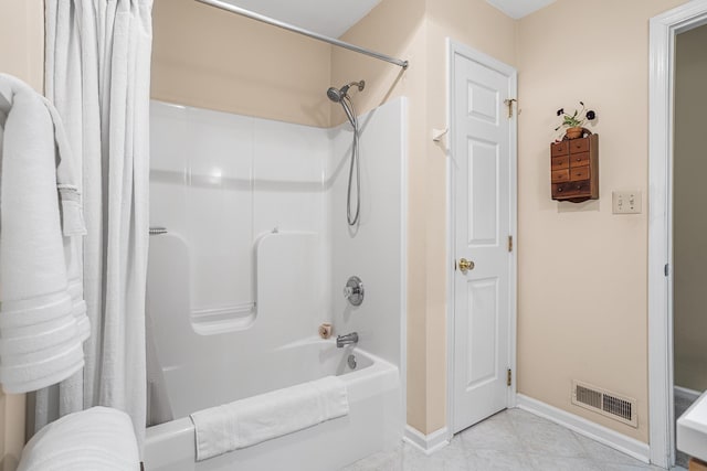 bathroom with shower / tub combo with curtain, baseboards, tile patterned floors, and visible vents