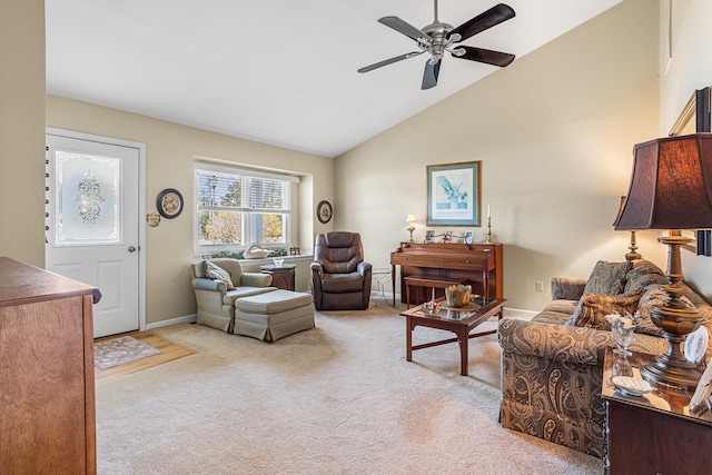 living room featuring light colored carpet, a ceiling fan, baseboards, and high vaulted ceiling