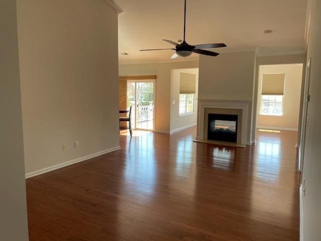 29 Falkirk Dr, Rio Grande, NJ 08242 - unfurnished living room featuring crown molding, a multi sided fireplace, a ceiling fan, wood finished floors, and baseboards