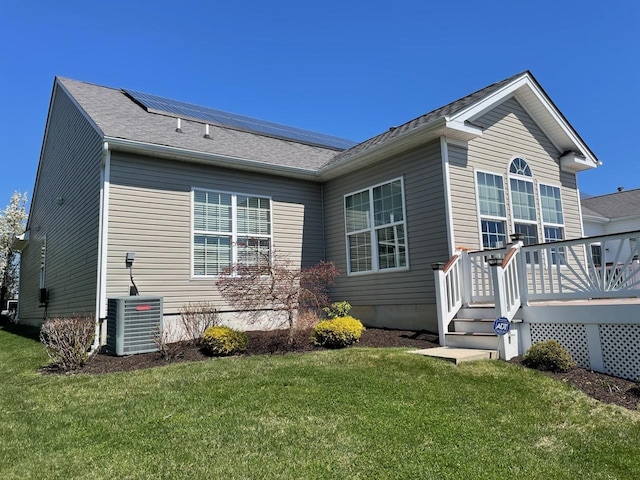 29 Falkirk Dr, Rio Grande, NJ 08242 - rear view of property featuring central AC, a deck, solar panels, and a lawn