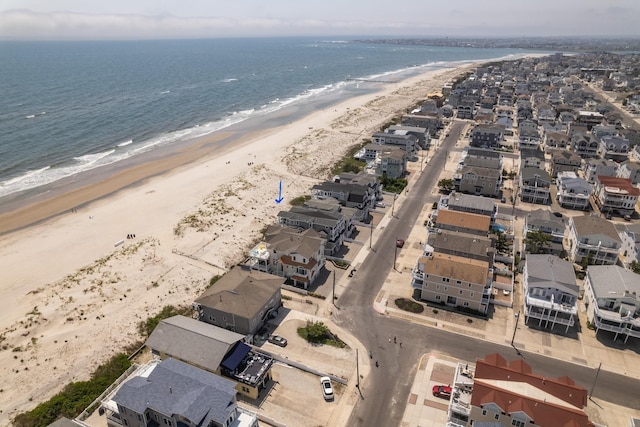 aerial view featuring a view of the beach and a water view