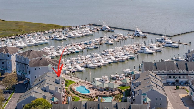 birds eye view of property with a water view