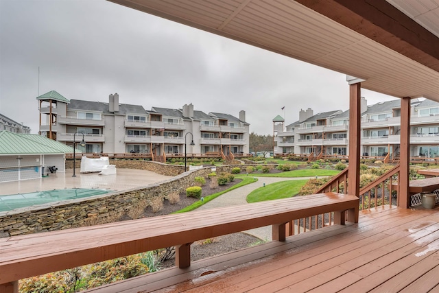 wooden deck with a residential view