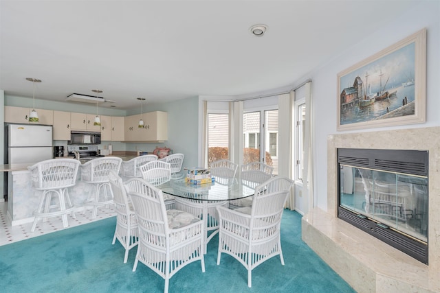 dining space with carpet floors