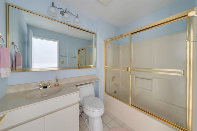 full bath featuring bath / shower combo with glass door, tile patterned flooring, vanity, and toilet