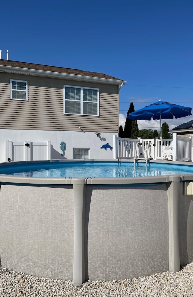 view of swimming pool featuring a fenced in pool