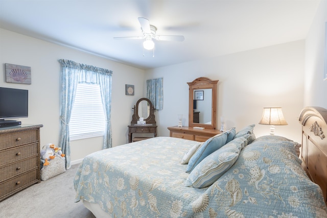 bedroom with light carpet and ceiling fan