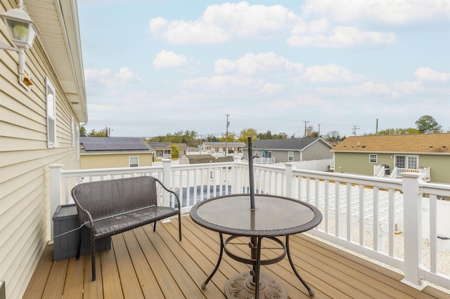 wooden terrace featuring a residential view