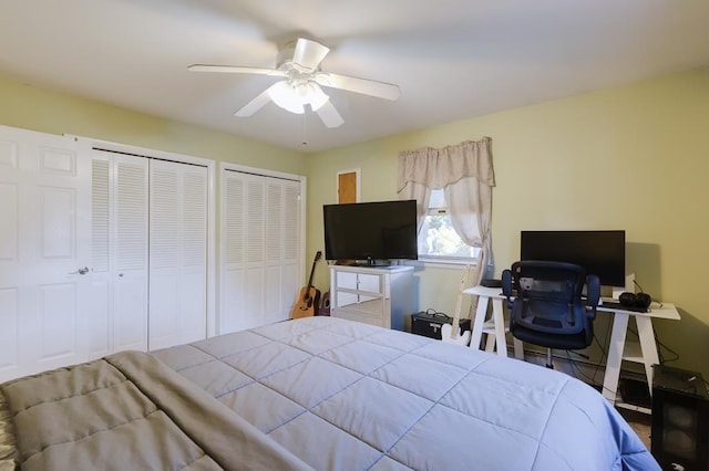 bedroom with multiple closets and ceiling fan