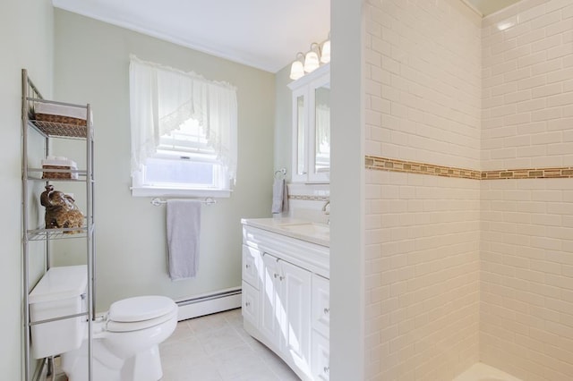 bathroom featuring a tile shower, a baseboard radiator, tile patterned floors, toilet, and vanity