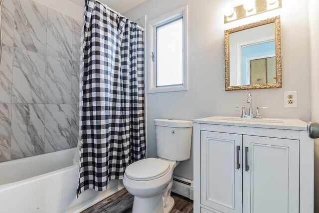 full bathroom featuring hardwood / wood-style floors, shower / bath combo, vanity, toilet, and baseboard heating