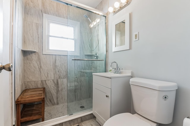 bathroom with vanity, toilet, and walk in shower